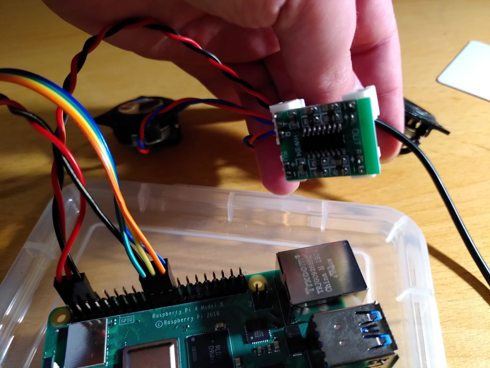 Image of the wiring: raspberry pi connected to the amplifier that has the two speakers connected